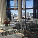 white cocktail table and white wire stool at an event