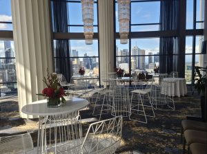 white cocktail table and white wire stool at an event