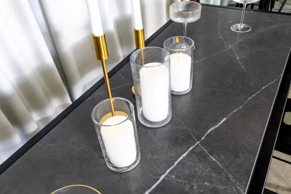 Candles place on a black marble table