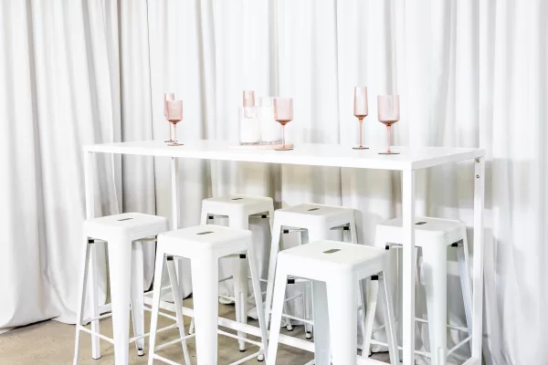 White rectangular tapas table with white tolix stools