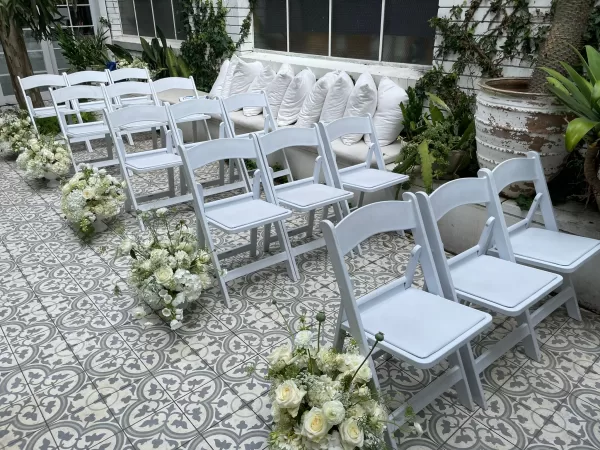 white padded folding chair