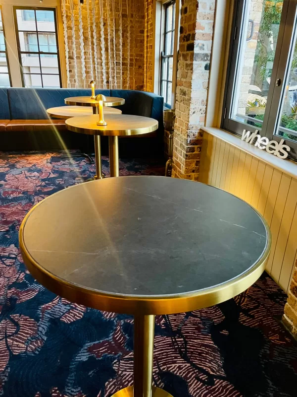 brass cocktail bar table with black marble table top