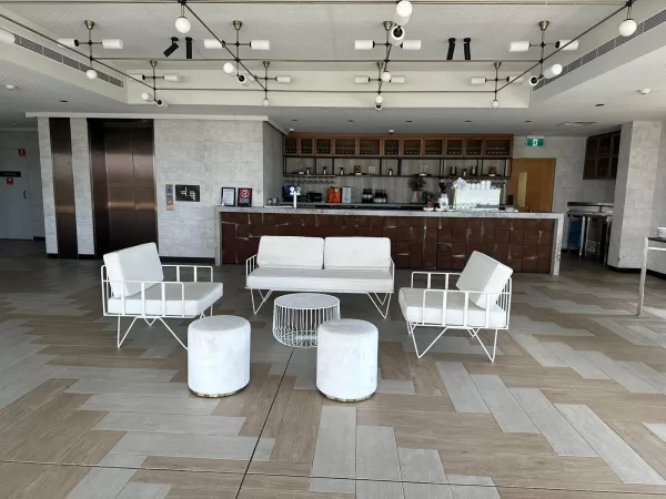 event with white wire arm chair, white wire sofa lounge, white wire coffee table and white velvet ottoman stool